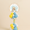 Winnie the Pooh balloon column with pastel blue yellow and white twisted base and round Pooh foil baby shower centrepiece