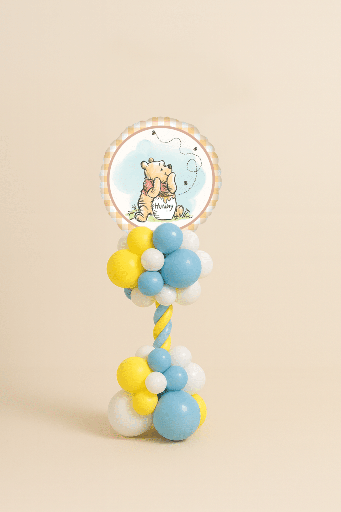 Winnie the Pooh balloon column with pastel blue yellow and white twisted base and round Pooh foil baby shower centrepiece