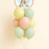 Classic Winnie the Pooh pastel balloon bouquet with sage green peach yellow and cream latex balloons and round Pooh foil baby shower arrangement