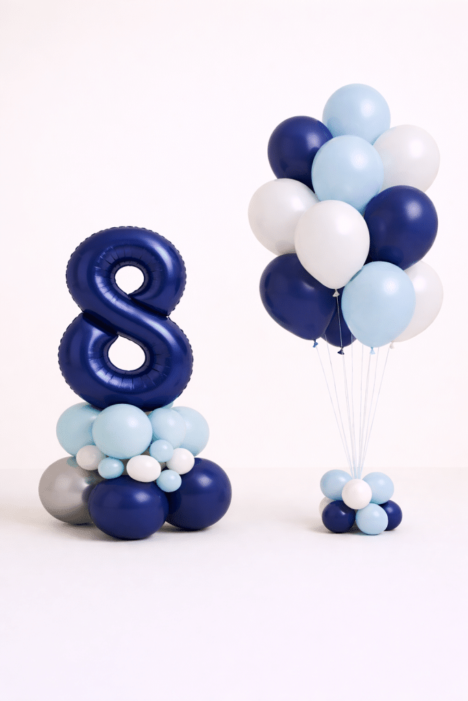 Navy blue number birthday balloon column with matching helium bouquet in ice blue white and silver chrome colours elegant birthday balloon duo