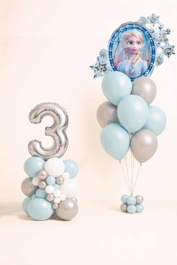 Frozen themed birthday balloon set with silver number column and matching ice blue white and silver helium balloon bouquet winter princess party decoration ⚠️ Please note In case a specific foil balloon is unavailable, a similar design of equal quality and theme will be used. Balloon shade colours may differ slightly from the picture depending on stock availability.
