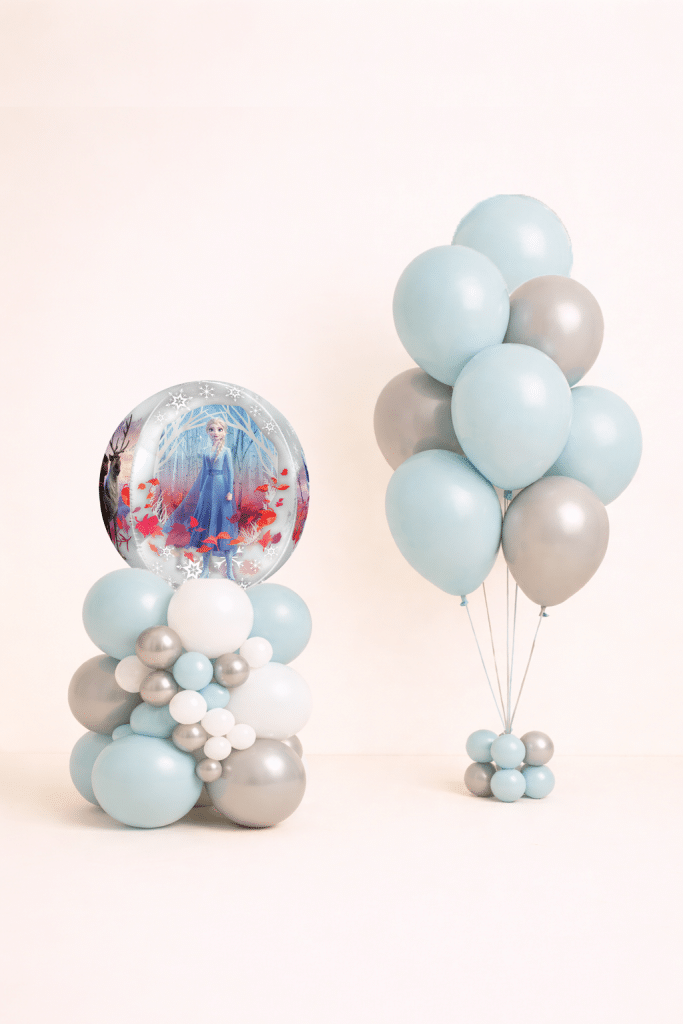 Frozen snow globe bubble balloon centerpiece with matching ice blue white and silver helium balloon bouquet winter princess birthday decoration