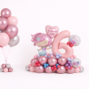 Mermaid themed birthday balloon arrangement with pastel number six foil balloon, mermaid character centrepiece and matching rose gold and silver helium balloon bouquet