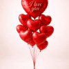 Valentine’s Day heart balloon bouquet with red heart-shaped foil balloons and I love you message, arranged in a floating bouquet on a neutral background.