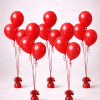 Set of five Valentine’s Day balloon bouquets with red latex balloons, red curling ribbons, and matching weighted bases on a neutral background.