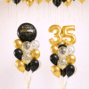 Black and gold birthday balloon package with gold number balloons happy birthday orb bouquet and black gold ceiling balloons luxury celebration setup
