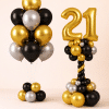 Black gold and silver birthday balloon duo with gold number balloon column and matching helium balloon bouquet elegant celebration decoration