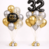 Black gold and silver birthday balloon duo with black number balloons and happy birthday round foil balloon with gold confetti elegant celebration decoration