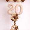 Nude number balloon column with chocolate brown cream and gold balloons and matching ceiling balloon decoration