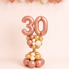 Rose gold number balloon column with blush gold and ivory ceiling balloons elegant birthday decoration