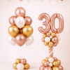 Rose gold number balloon column with matching blush ivory gold bouquet and ceiling balloons elegant birthday decoration
