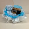 Baby boy gift box with blue Keel Toys teddy bear, AMEK Toys silicone vacuum bowl and silicone teether, presented in blue and white wrapping.