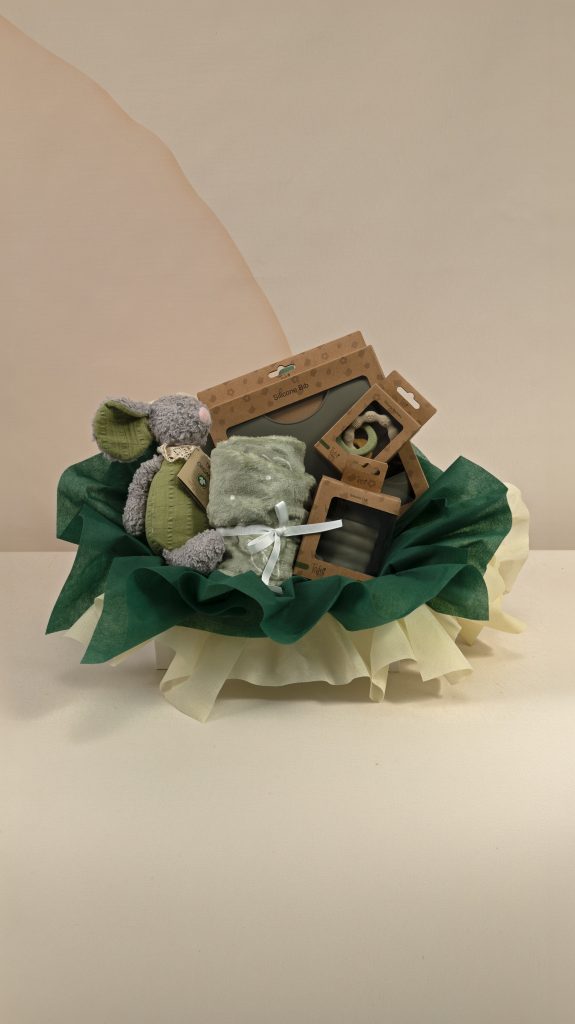 Forest green baby gift box with soft mouse toy, sage baby blanket, silicone bib, cup and teether, beautifully presented with dark green and ivory wrapping.