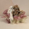 Neutral baby gift box with ivory plush bunny, AMEK Toys silicone bib, vacuum bowl, cup, cutlery and teethers, presented in dusty pink and ivory wrapping.