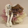Ivory bunny baby gift box with blush silicone divided plate, bib, cup, cutlery and teether, presented with blush and ivory wrapping.