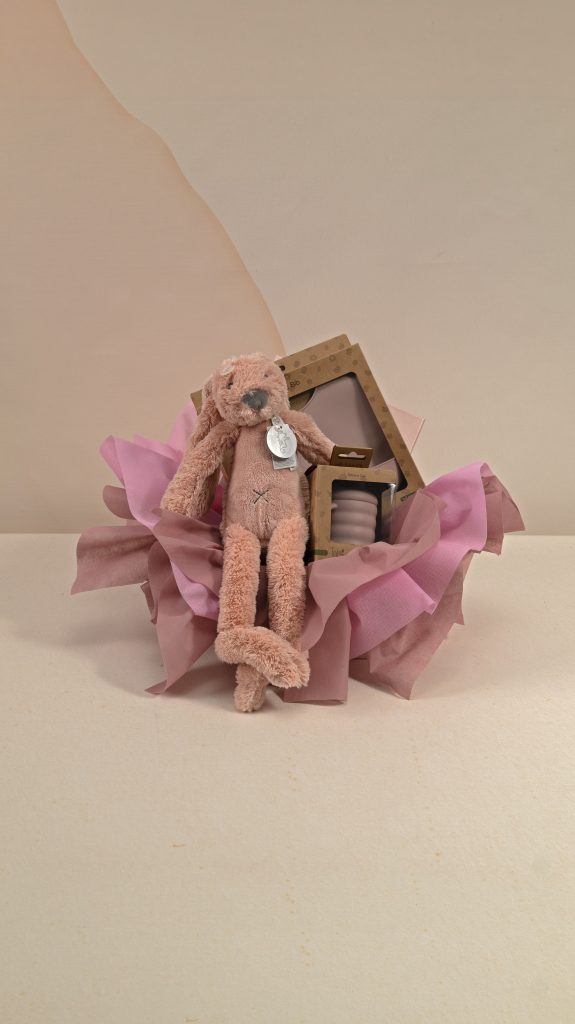 Blush bunny baby gift box with matching silicone bib and cup, beautifully presented with pink and dusty rose wrapping.